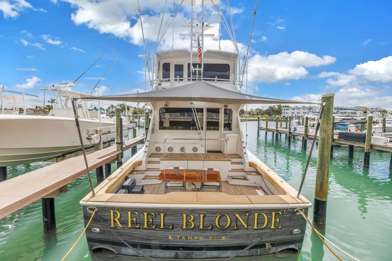 Slide: The Image of 1999 Viking 72 Enclosed Bridge yacht "Reel Blonde" docked in Tampa marina. - 6