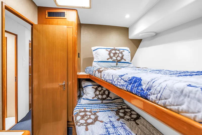 Slide: The Image of Cozy cabin with nautical-themed bunk beds on 1999 Viking 72 Enclosed Bridge yacht. - 64