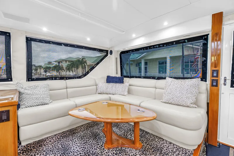 Slide: The Image of Luxurious interior of 1999 Viking 72 Enclosed Bridge yacht with plush seating and elegant decor. - 91