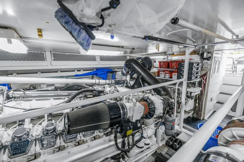 Slide: The Image of Engine room of a 1999 Viking 72 Enclosed Bridge yacht, showcasing machinery and equipment. - 96