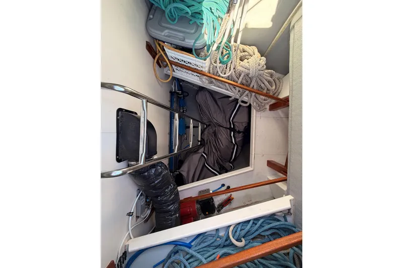 Slide: The Image of Storage compartment of a 2008 Hanse 540e yacht with ropes and equipment. - 17