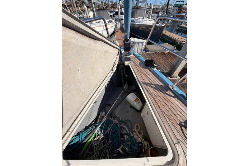 Slide: The Image of Open storage compartment on 2008 Hanse 540e sailboat with ropes and equipment. - 19