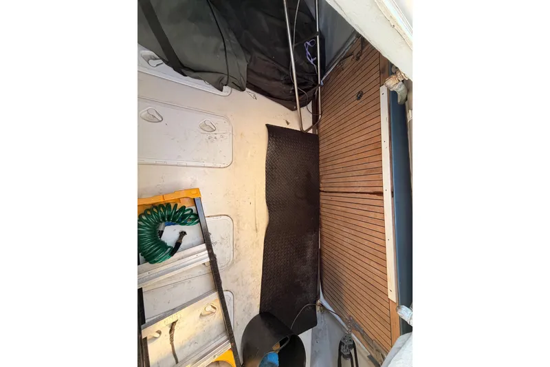 Slide: The Image of Interior storage area of 2008 Hanse 540e yacht with equipment and wooden flooring. - 29