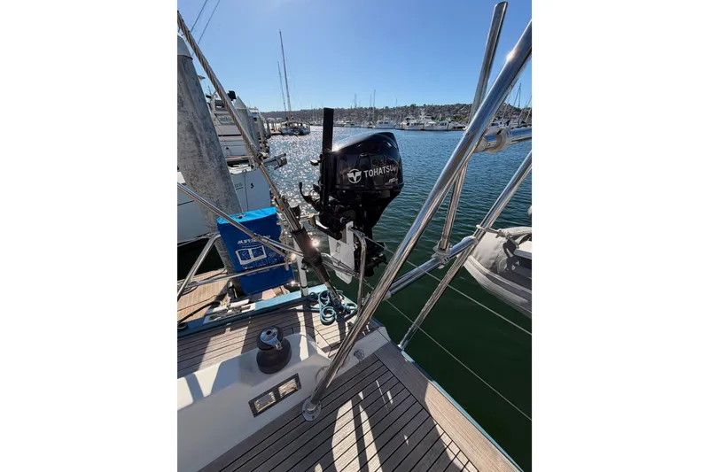 Slide: The Image of 2008 Hanse 540e yacht with Tohatsu outboard motor at marina. - 32