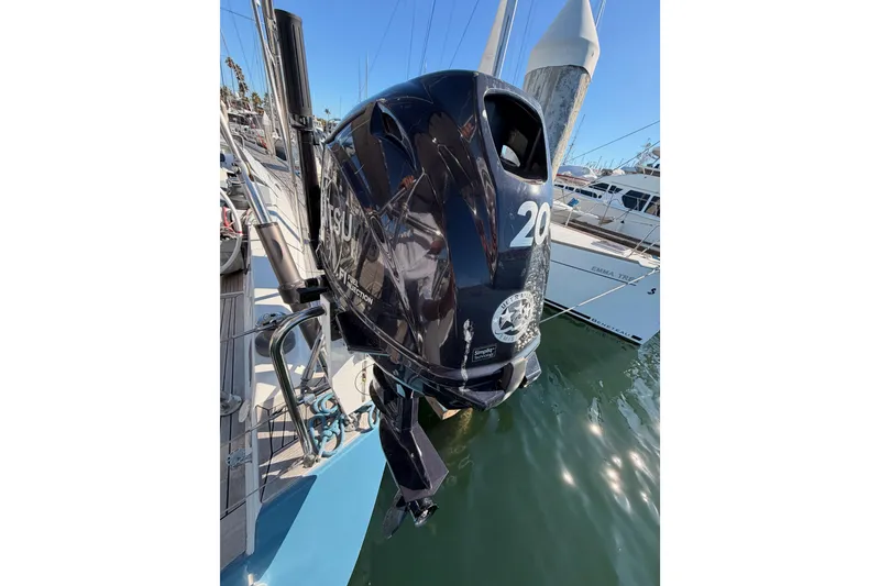 Slide: The Image of Outboard motor on a 2008 Hanse 540e yacht docked at a marina. - 33