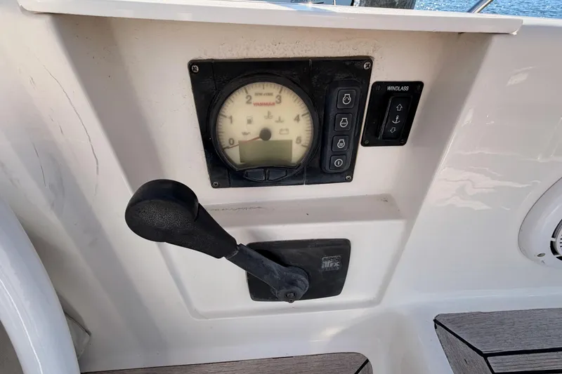 Slide: The Image of Control panel of a 2008 Hanse 540e sailboat with throttle and windlass controls. - 36