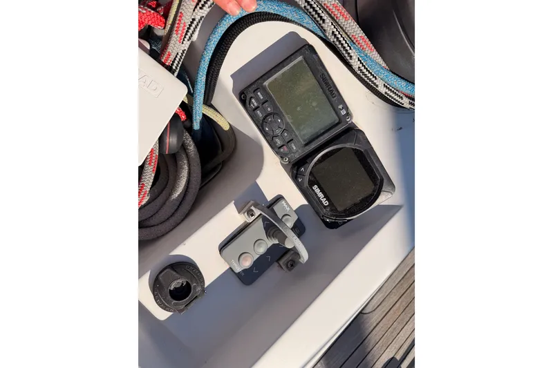 Slide: The Image of Sailing equipment on a 2008 Hanse 540e yacht, featuring Simrad instruments and colorful ropes. - 39