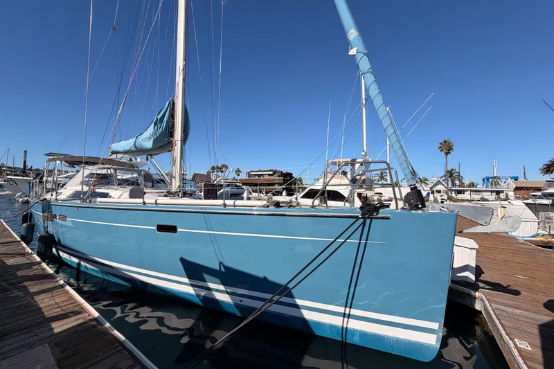 Slide: The Image of 2008 Hanse 540e sailboat docked at marina under clear blue sky. - 4