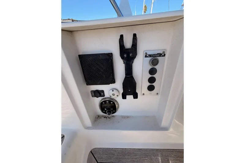 Slide: The Image of Control panel of a 2008 Hanse 540e yacht cockpit with various switches and mounts. - 41