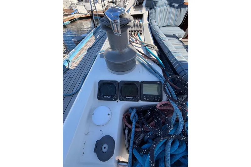 Slide: The Image of 2008 Hanse 540e yacht deck with winch, ropes, and navigation instruments. - 42