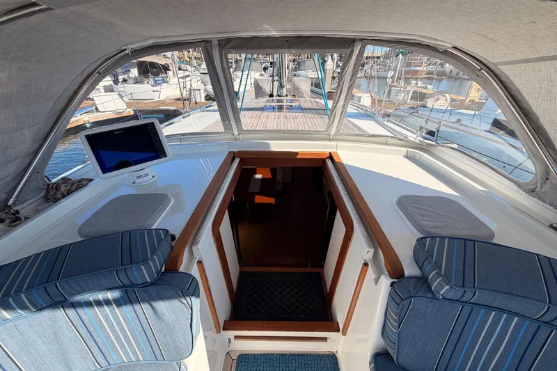 Slide: The Image of 2008 Hanse 540e yacht cockpit with striped cushions and navigation equipment. - 45
