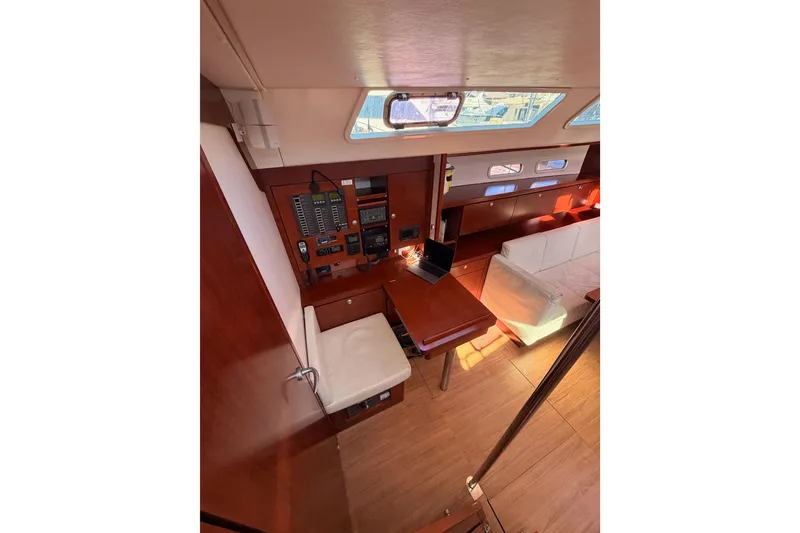 Slide: The Image of Interior of 2008 Hanse 540e yacht with wooden furnishings and navigation equipment. - 47