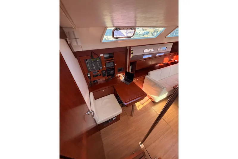 Slide: The Image of Interior of 2008 Hanse 540e yacht with navigation station and seating area. - 48