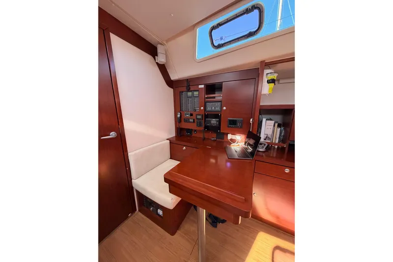 Slide: The Image of Interior of 2008 Hanse 540e yacht with navigation station and wooden cabinetry. - 50