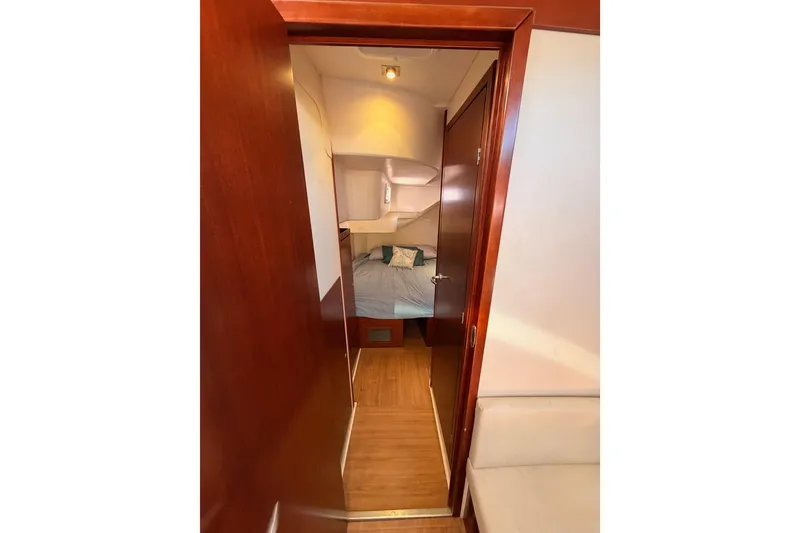 Slide: The Image of Interior of 2008 Hanse 540e yacht showing cozy cabin with wooden finish. - 53