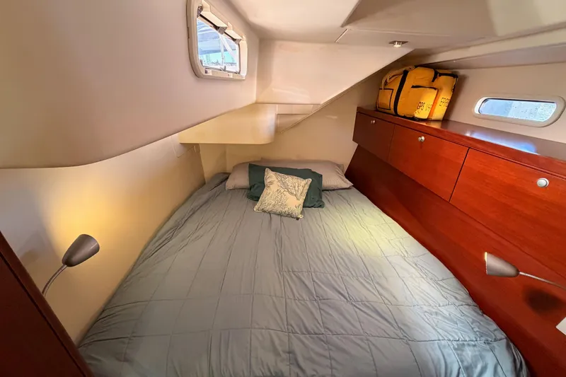 Slide: The Image of Cozy cabin interior of 2008 Hanse 540e yacht with bed and storage. - 55