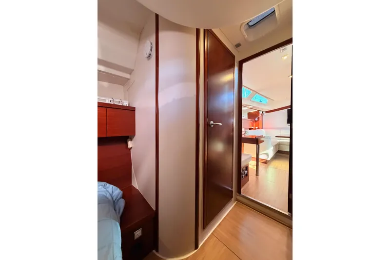 Slide: The Image of Interior of 2008 Hanse 540e yacht, featuring cozy cabin and modern living area. - 57