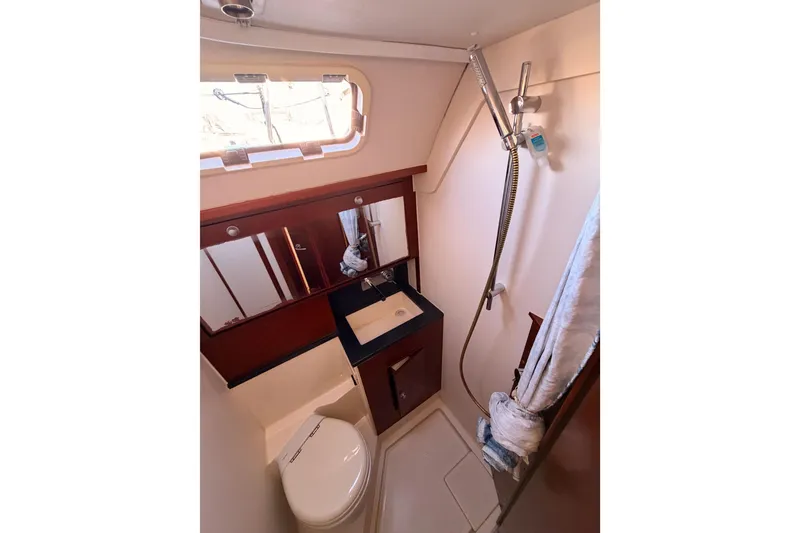 Slide: The Image of 2008 Hanse 540e yacht bathroom with shower, sink, and toilet. - 58