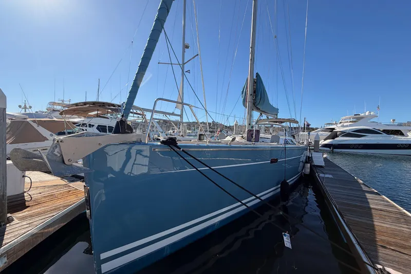 Slide: The Image of 2008 Hanse 540e sailboat docked at marina under clear blue sky. - 6