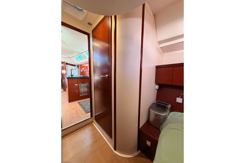 Slide: The Image of Interior of 2008 Hanse 540e yacht, featuring wooden cabinetry and modern design. - 66