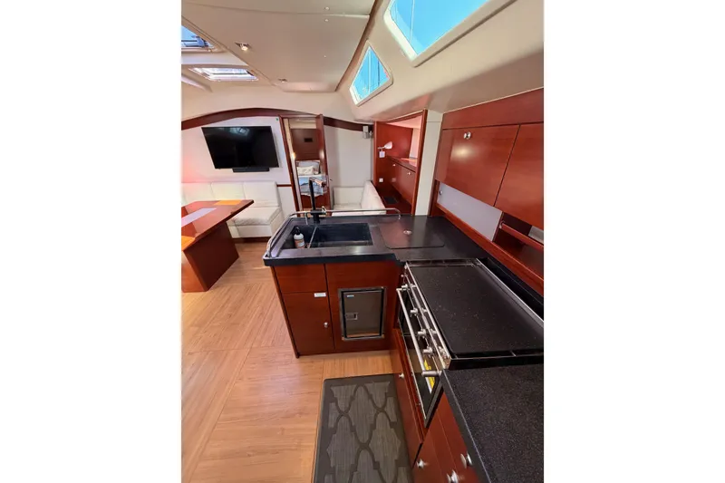 Slide: The Image of Luxurious interior of 2008 Hanse 540e yacht with modern kitchen and seating area. - 73