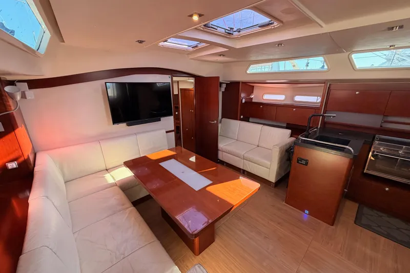 Slide: The Image of Luxurious 2008 Hanse 540e yacht interior with elegant wood finishes and modern amenities. - 76