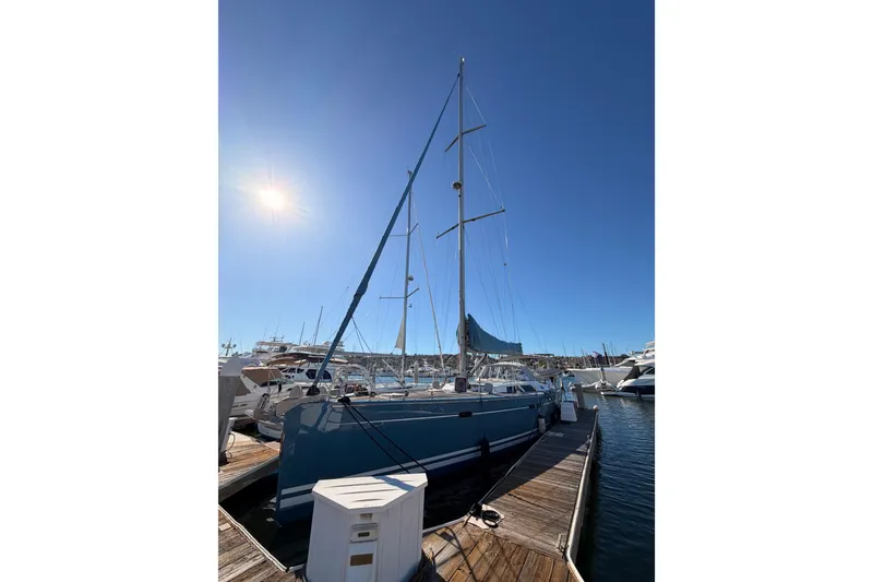 Slide: The Image of 2008 Hanse 540e sailboat docked under clear blue sky. - 8
