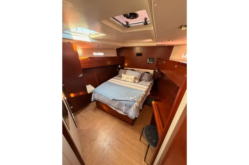 Slide: The Image of Luxurious 2008 Hanse 540e yacht cabin with cozy bed and elegant wood finish. - 81