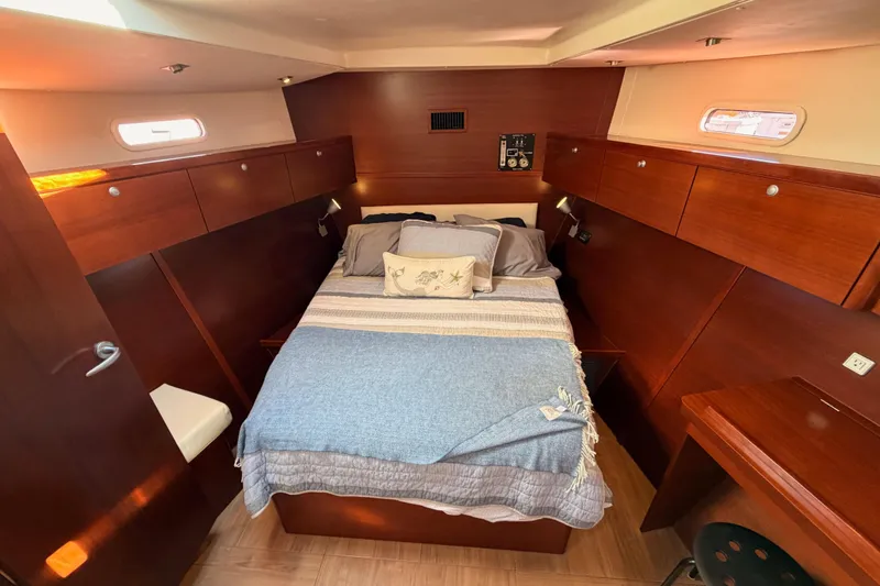 Slide: The Image of Luxurious 2008 Hanse 540e yacht cabin with cozy bed and wooden interior. - 82
