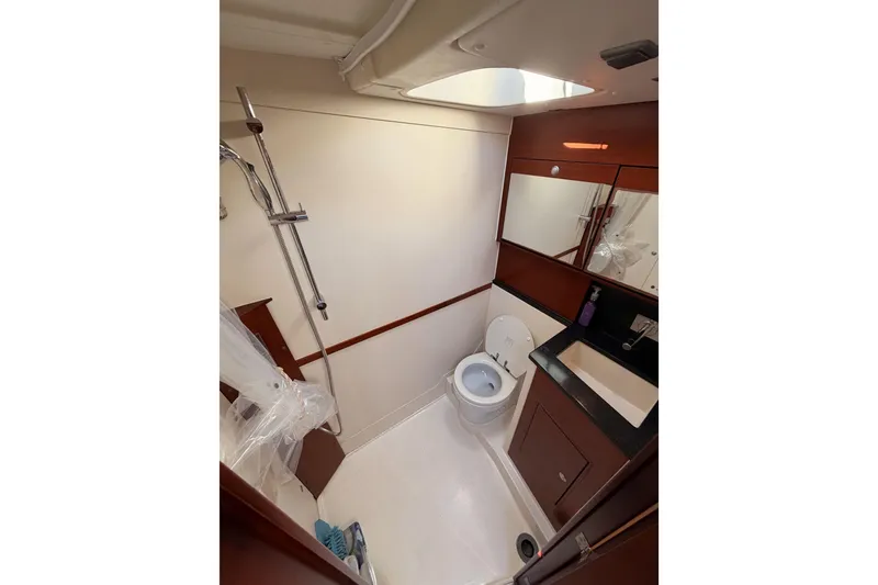 Slide: The Image of Bathroom interior of 2008 Hanse 540e yacht with shower, toilet, and sink. - 84