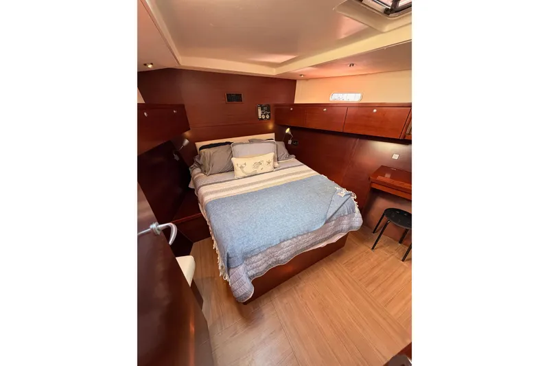 Slide: The Image of Luxurious 2008 Hanse 540e yacht cabin with cozy bed and wooden interior. - 85
