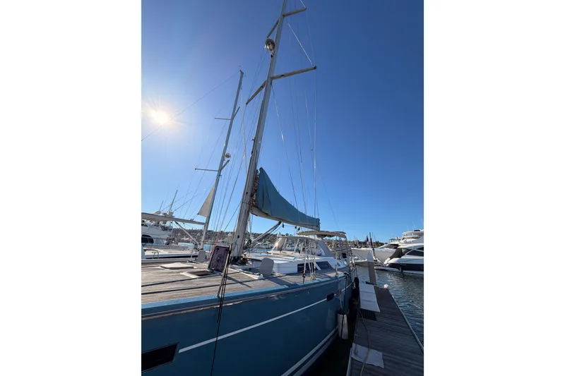 Slide: The Image of 2008 Hanse 540e sailboat docked under clear blue sky. - 9