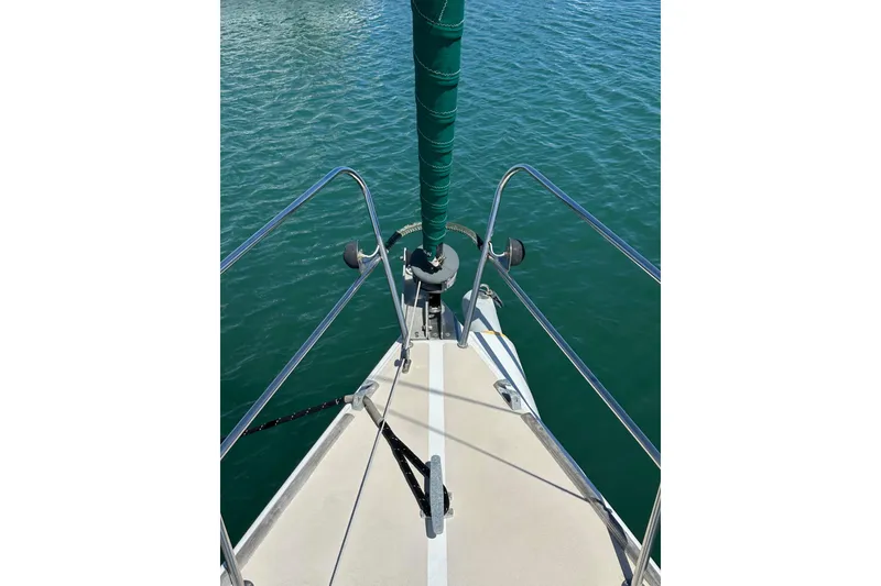 Slide: The Image of Bow view of 1996 J Boats J/120 sailboat on calm water. - 14
