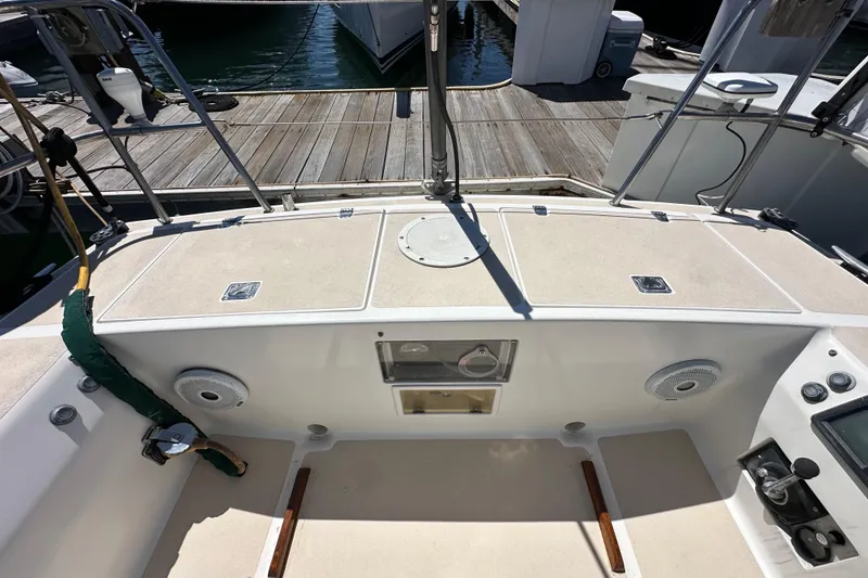Slide: The Image of Cockpit of a 1996 J Boats J/120 sailboat, docked at a marina. - 26