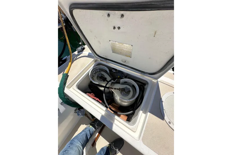 Slide: The Image of Open storage compartment on 1996 J Boats J/120 sailboat, showing propane tanks and equipment. - 29