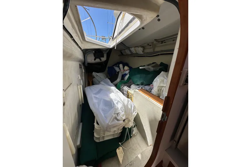 Slide: The Image of Interior cabin of 1996 J Boats J/120 sailboat with stored sails and equipment. - 33