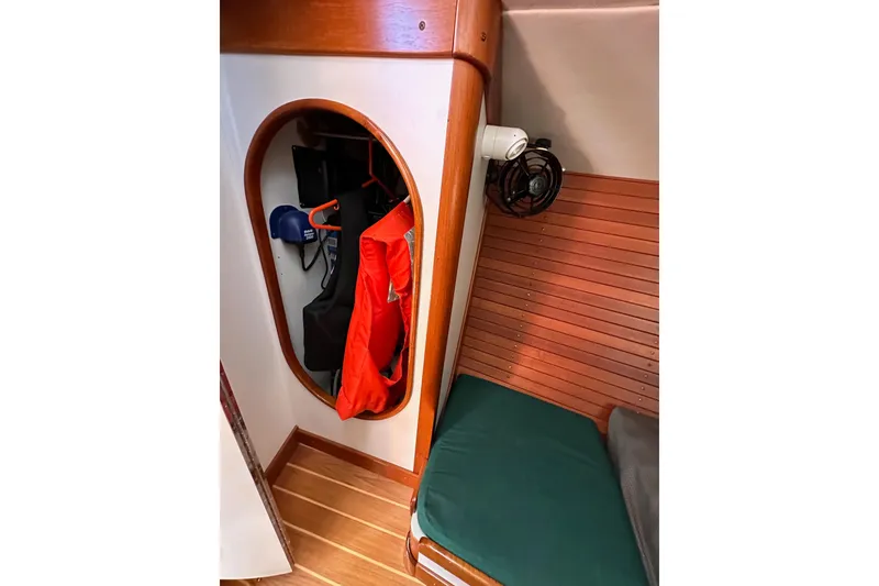 Slide: The Image of Cozy cabin interior of 1996 J Boats J/120 with storage and seating. - 47