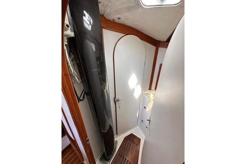 Slide: The Image of Interior of 1996 J Boats J/120 sailboat, featuring sleek design and wooden accents. - 64
