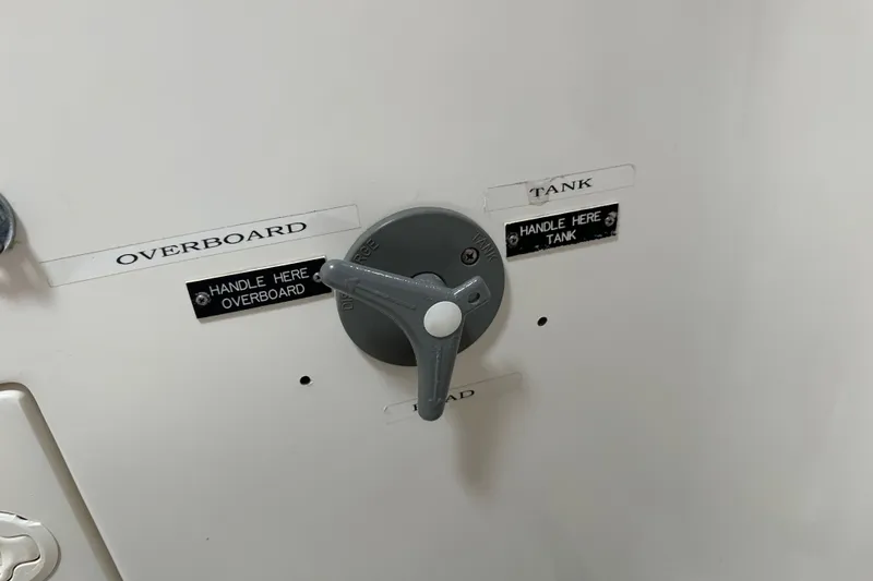 Slide: The Image of Control valve on 1996 J Boats J/120, labeled for overboard and tank discharge. - 69
