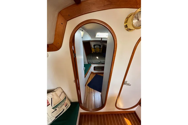 Slide: The Image of Interior of 1996 J Boats J/120 sailboat with wooden accents and cozy cabin. - 72