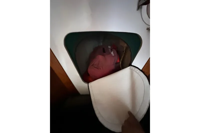 Slide: The Image of Interior storage compartment of a 1996 J Boats J/120 sailboat. - 76