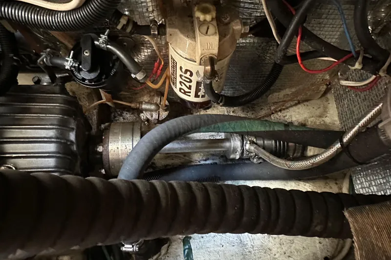 Slide: The Image of Engine compartment of a 1996 J Boats J/120, showcasing mechanical components and wiring. - 91