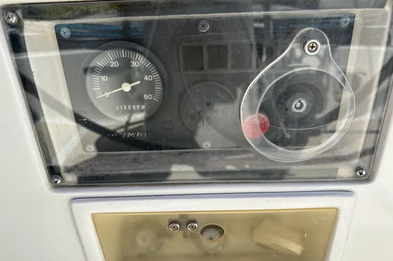 Slide: The Image of Close-up of a 1996 J Boats J/120 engine control panel with RPM gauge. - 95