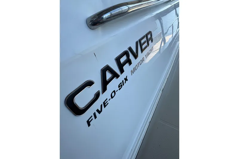 Slide: The Image of 2002 Carver 506 Motor Yacht side view with logo and railing. - 17