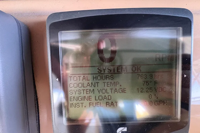 Slide: The Image of Display screen of 2002 Carver 506 Motor Yacht showing system status and engine metrics. - 27