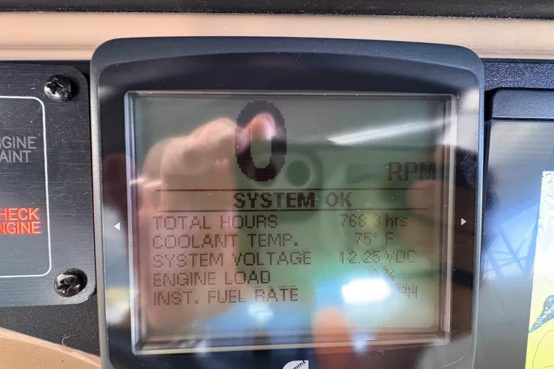 Slide: The Image of Display screen of a 2002 Carver 506 Motor Yacht showing engine metrics. - 28
