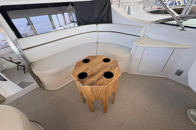 Slide: The Image of Luxurious interior of 2002 Carver 506 Motor Yacht with elegant seating and wooden table. - 31