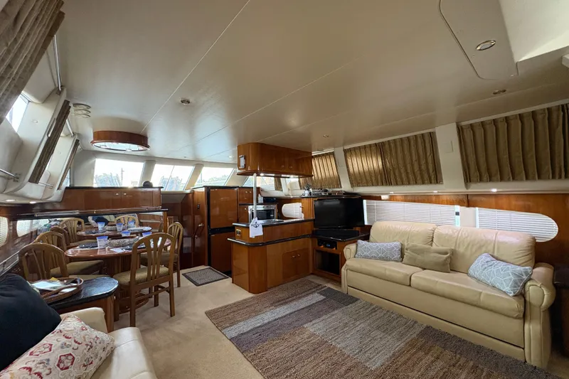 Slide: The Image of Luxurious interior of 2002 Carver 506 Motor Yacht with elegant furnishings and ample natural light. - 37