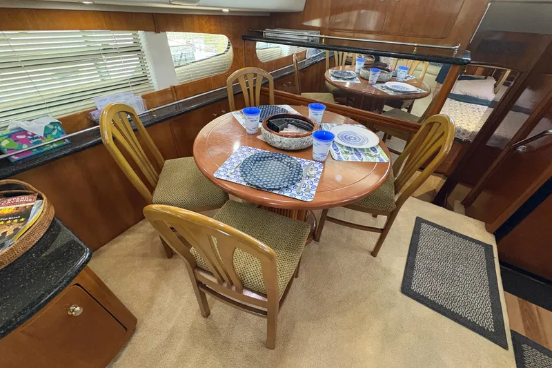 Slide: The Image of Interior of 2002 Carver 506 Motor Yacht with dining table and chairs. - 38