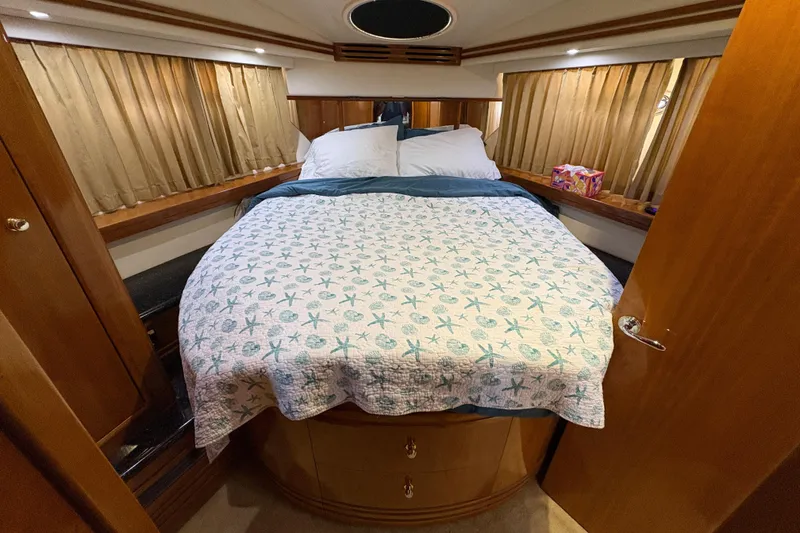 Slide: The Image of Cozy bedroom in 2002 Carver 506 Motor Yacht with nautical-themed bedding. - 46